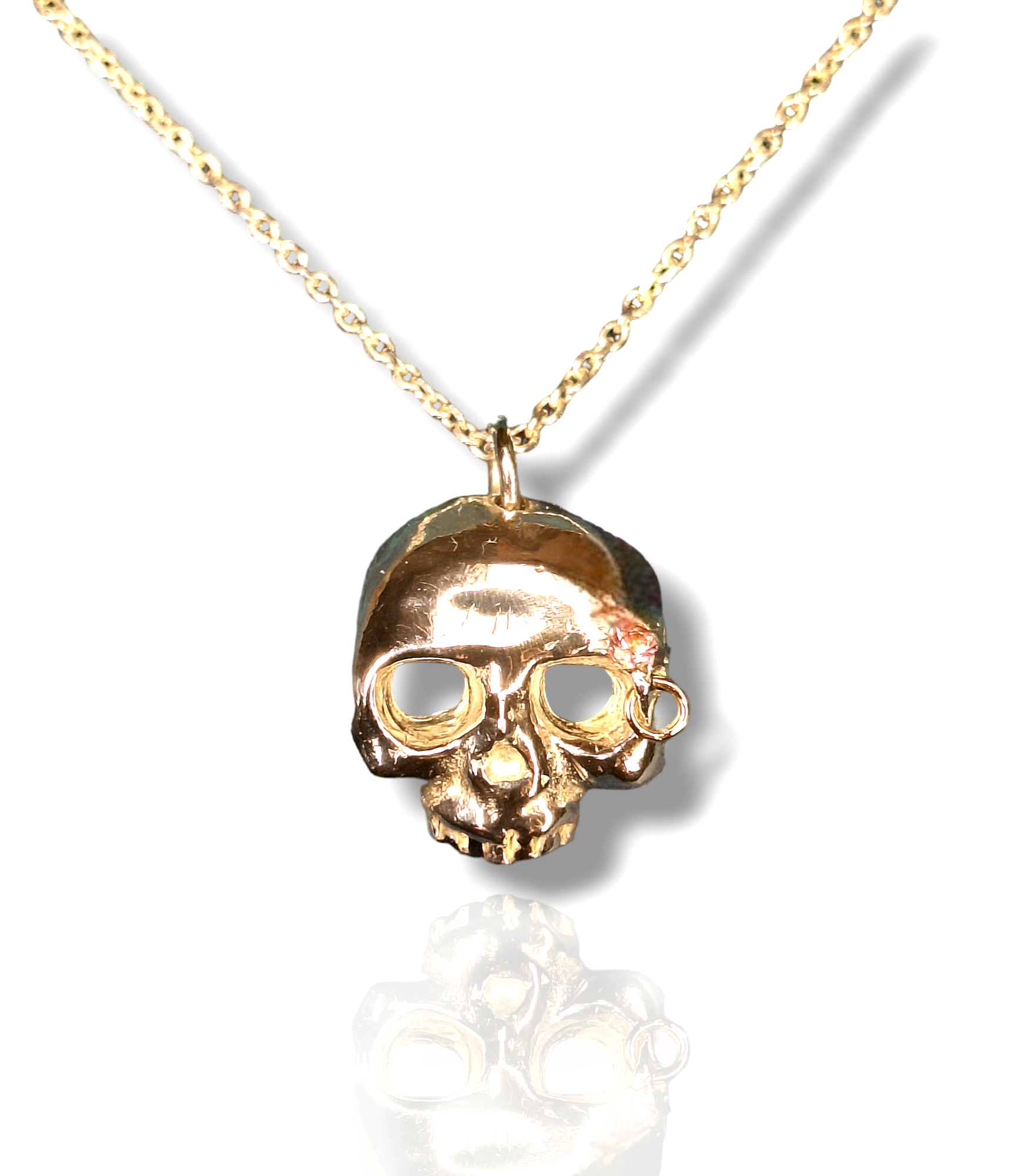 Grainne Mhaol Necklace - Sterling silver & pink sapphire skull necklace