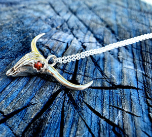 Flidais - Sterling silver cow skull with orange sapphire